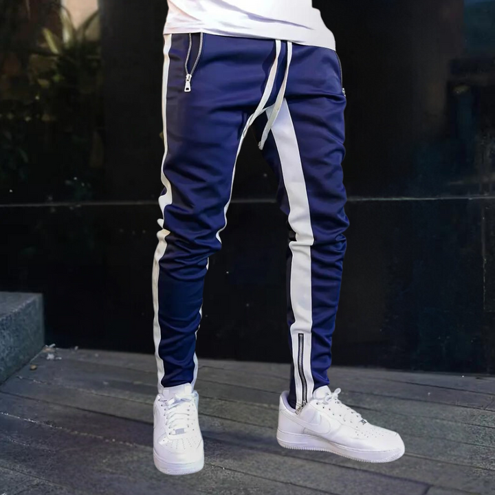 Tapered men's slim fit joggers, perfect for daily casual wear & sports. Features contrast panels and zip cuffs.