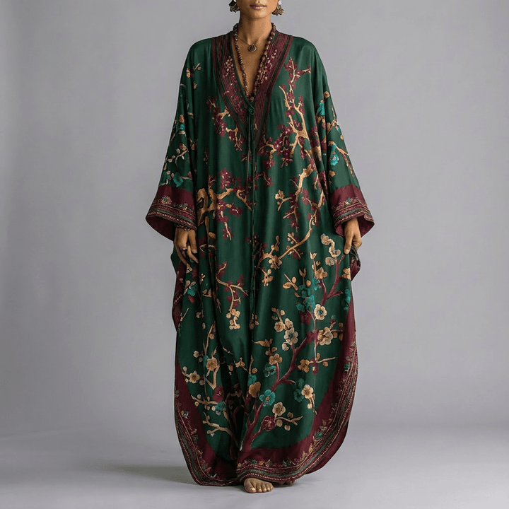 Beige women's maxi dress showcasing elegant batwing sleeves and a stunning floral print, ideal for casual wear.