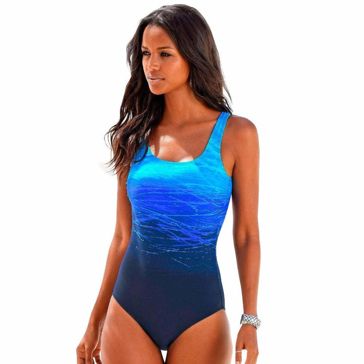 Athletic women's ombre one-piece swimsuit. Quick-dry, sporty design, back cutout for active beach & pool days.