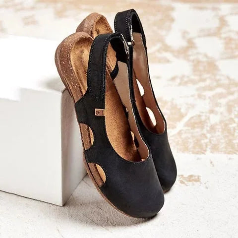 Comfortable women's flats featuring a closed toe and slingback strap. Ideal casual or dress shoes.