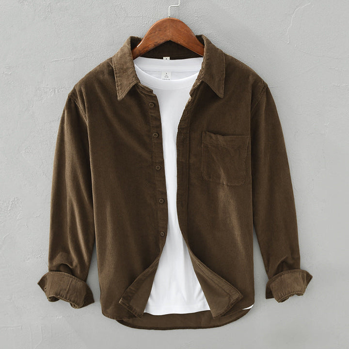 Stylish man wearing elegant retro style button-down long sleeve shirt for versatile casual wear. Men's fashion top.