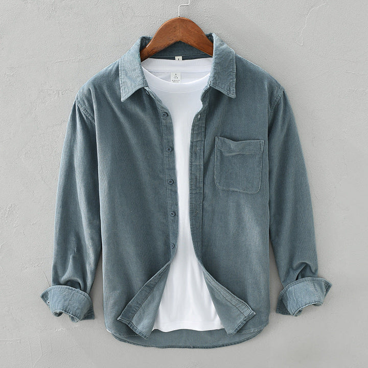 Man enjoying comfortable casual wear in an elegant retro style long sleeve button-down shirt. Versatile men's fashion top.