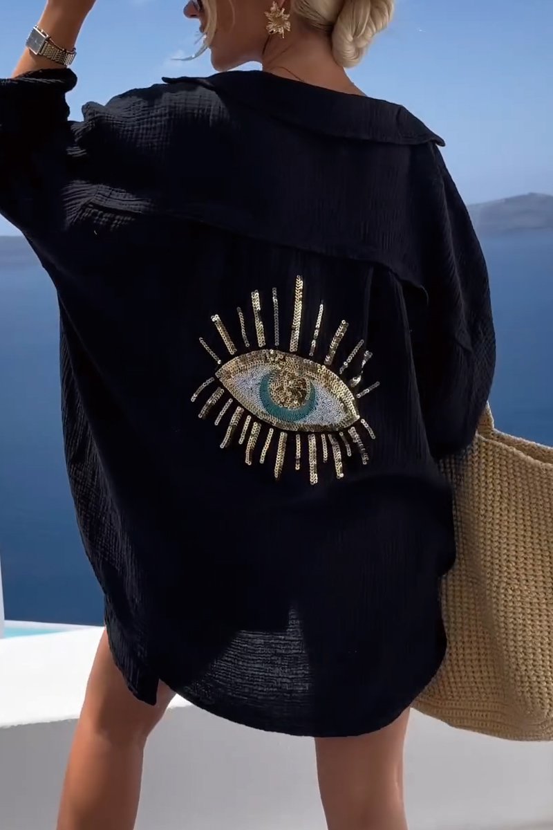 Comfortable Nora oversized blouse for women, featuring a unique eye pattern. Perfect for holiday wear & casual summer fashion.