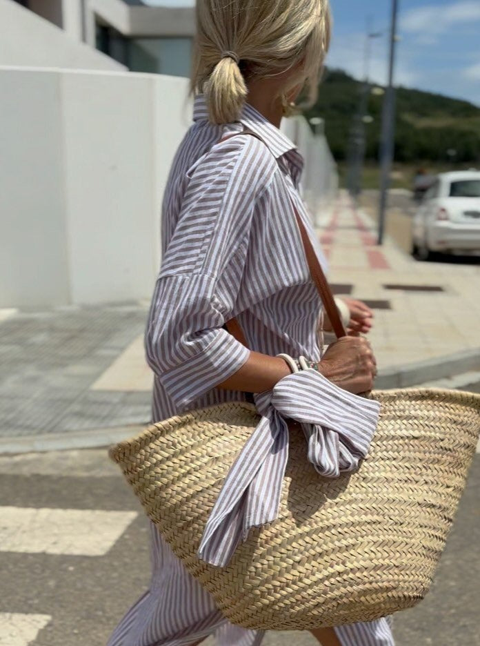 Stylish women's striped midi dress. Comfortable and elegant, ideal for spring & summer casual wear.