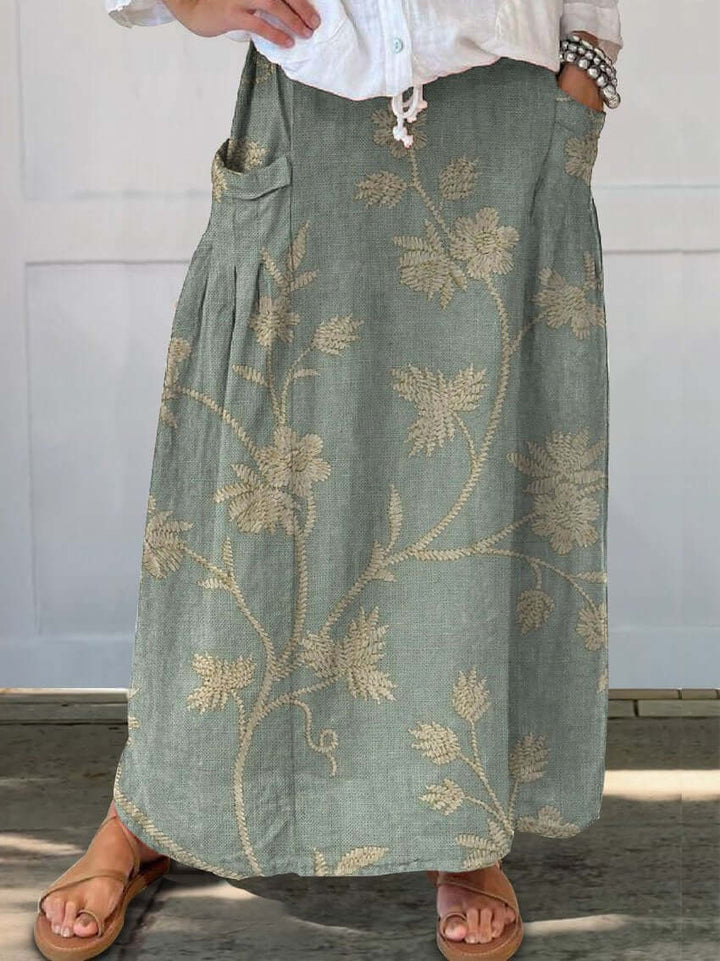 Comfortable women's floral midi skirt. Retro elastic waist design, perfect for elegant casual fashion.