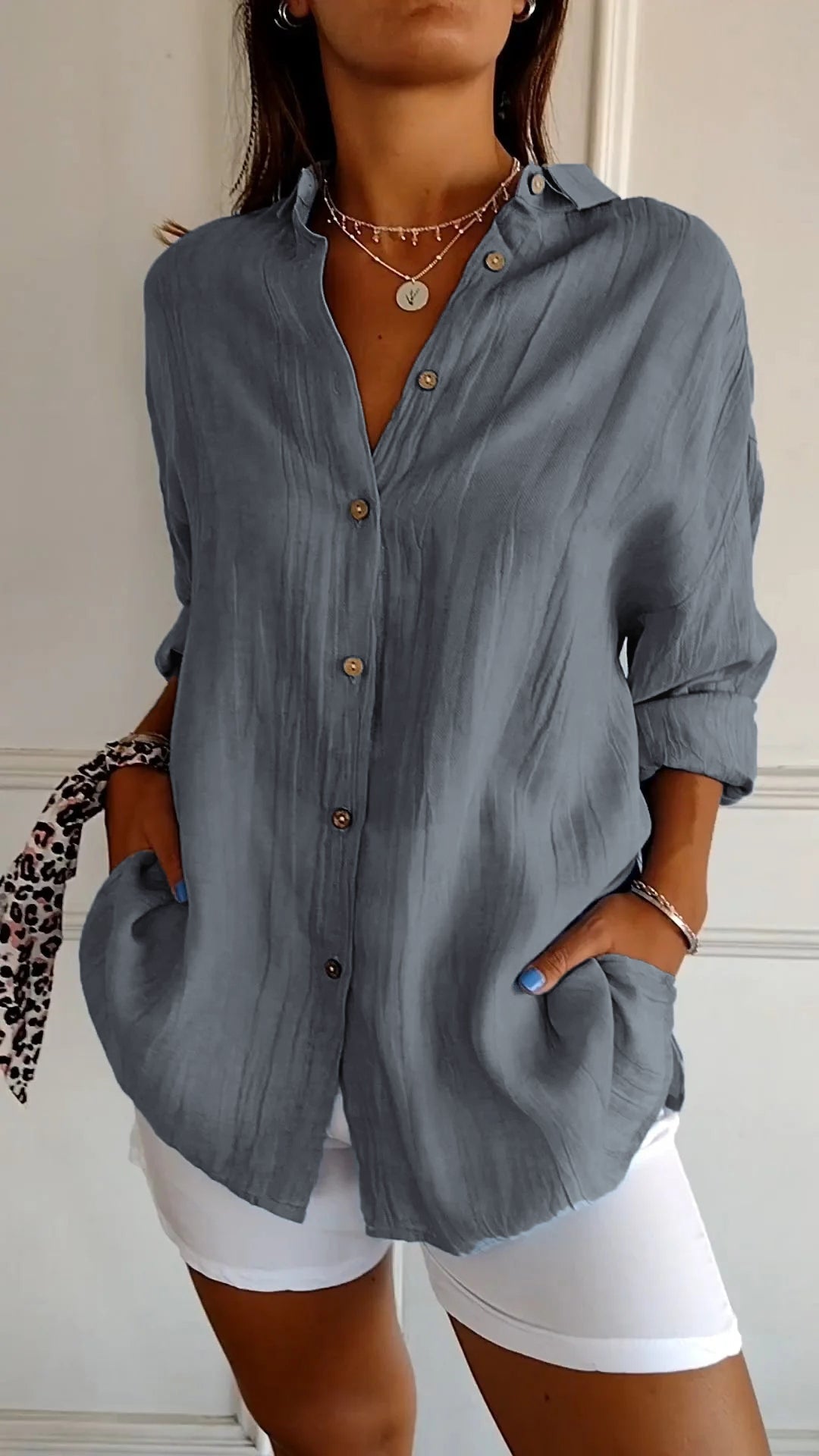 Professional women's long sleeve top, featuring a stylish ruffled collar for work.