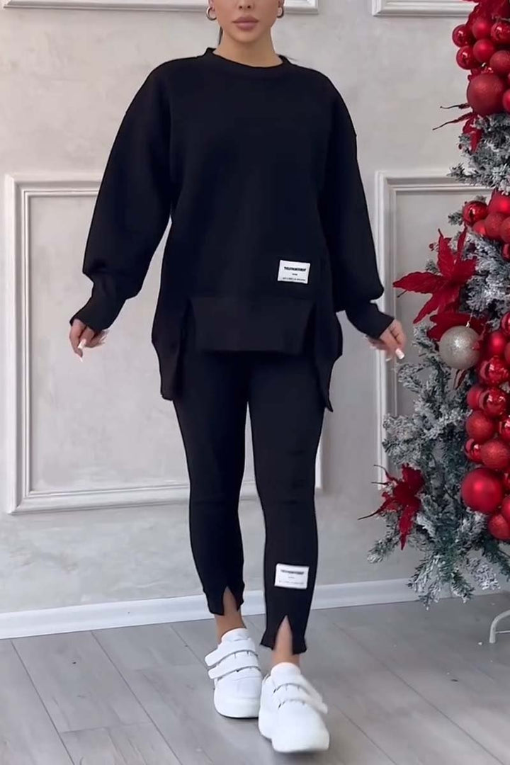 Stylish women's oversized loungewear set with a relaxed fit crew neck sweater & comfy leggings for casual wear.