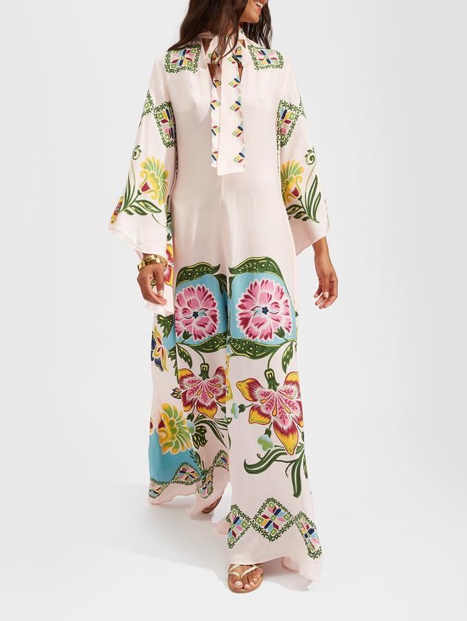 Comfortable cream floral maxi dress for women, with elegant long sleeves and a beautiful flowing summer design.