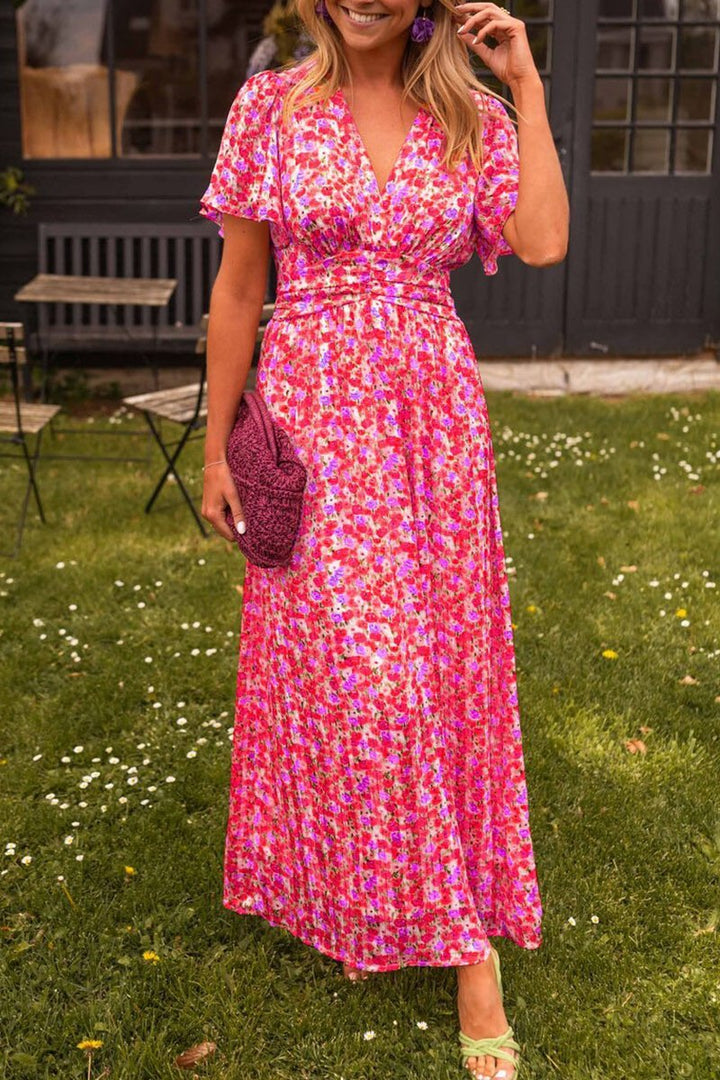 Vibrant floral pattern on a flowy V-neck maxi dress, a perfect elegant summer or spring fashion statement.
