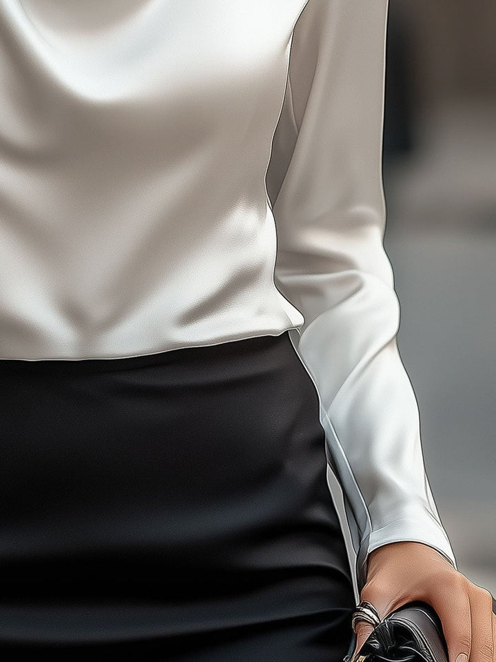 Refined satin ladies' blouse with a graceful draped neckline, suitable for dressy occasions.