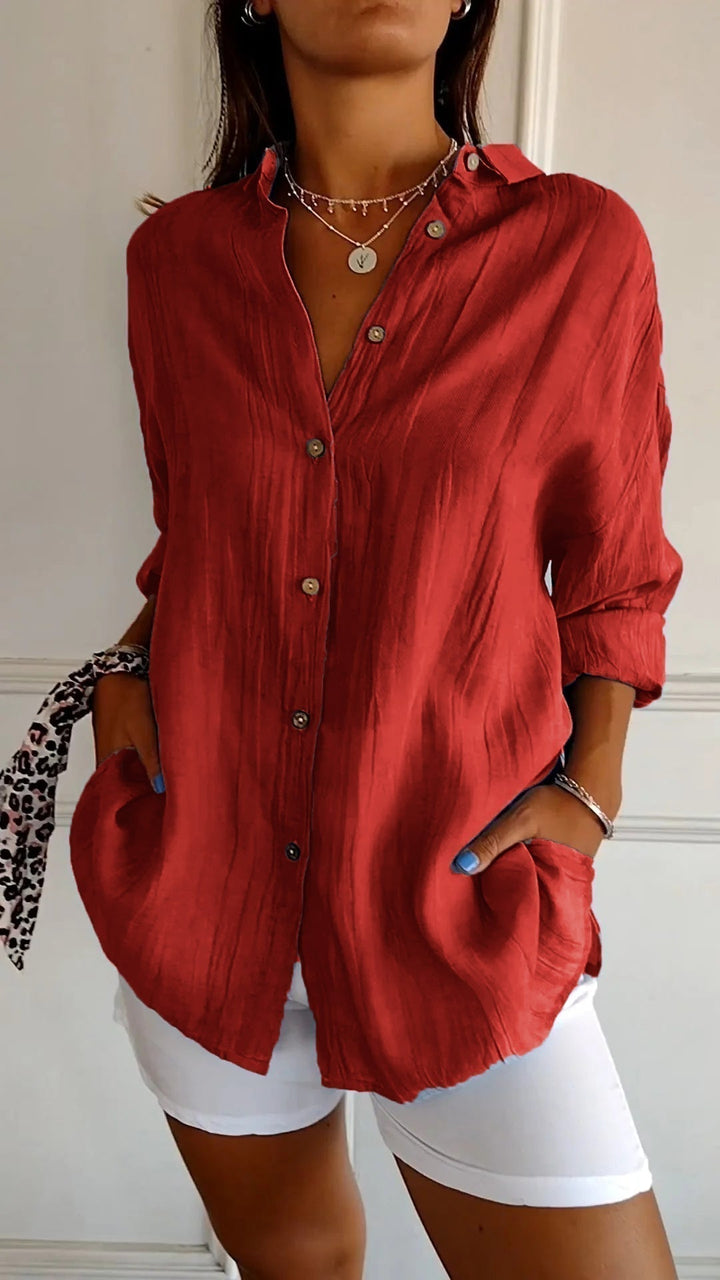 Women's formal blouse with chic ruffled collar, perfect for an elegant professional look.