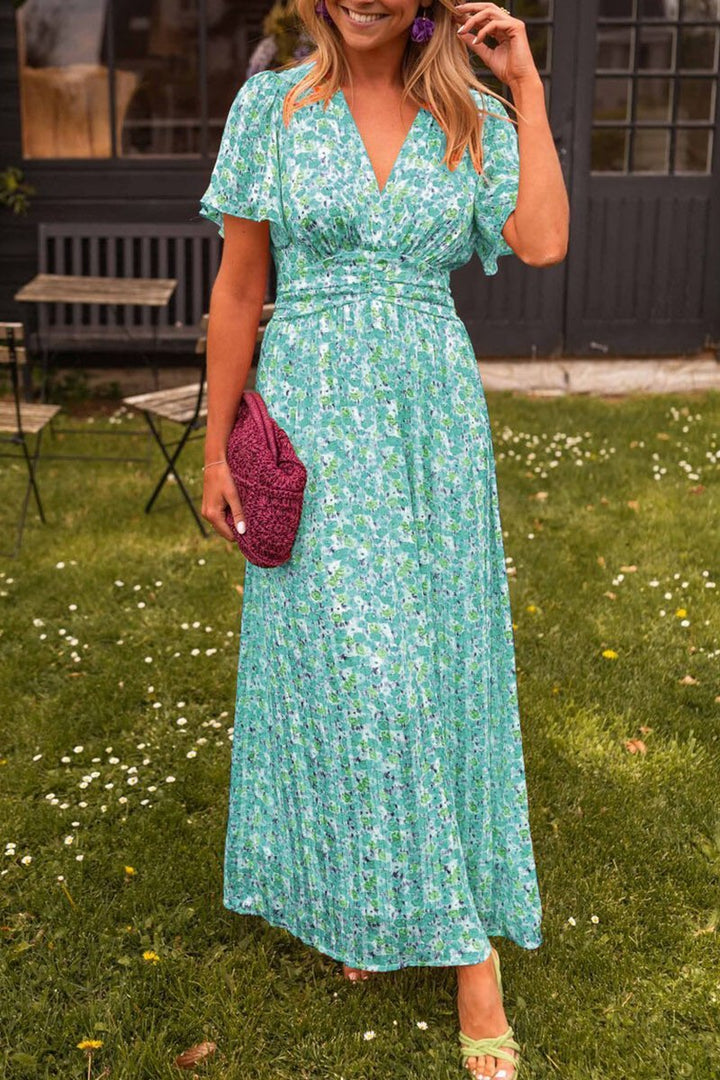 Women's elegant floral maxi dress with a flattering V-neck, designed for comfortable summer and spring wear.