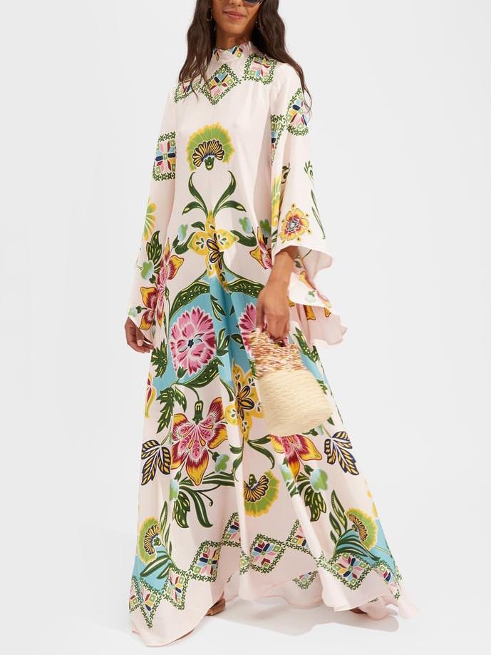 Elegant women's floral maxi dress with long sleeves, flowing cream fabric, perfect for summer occasion wear.