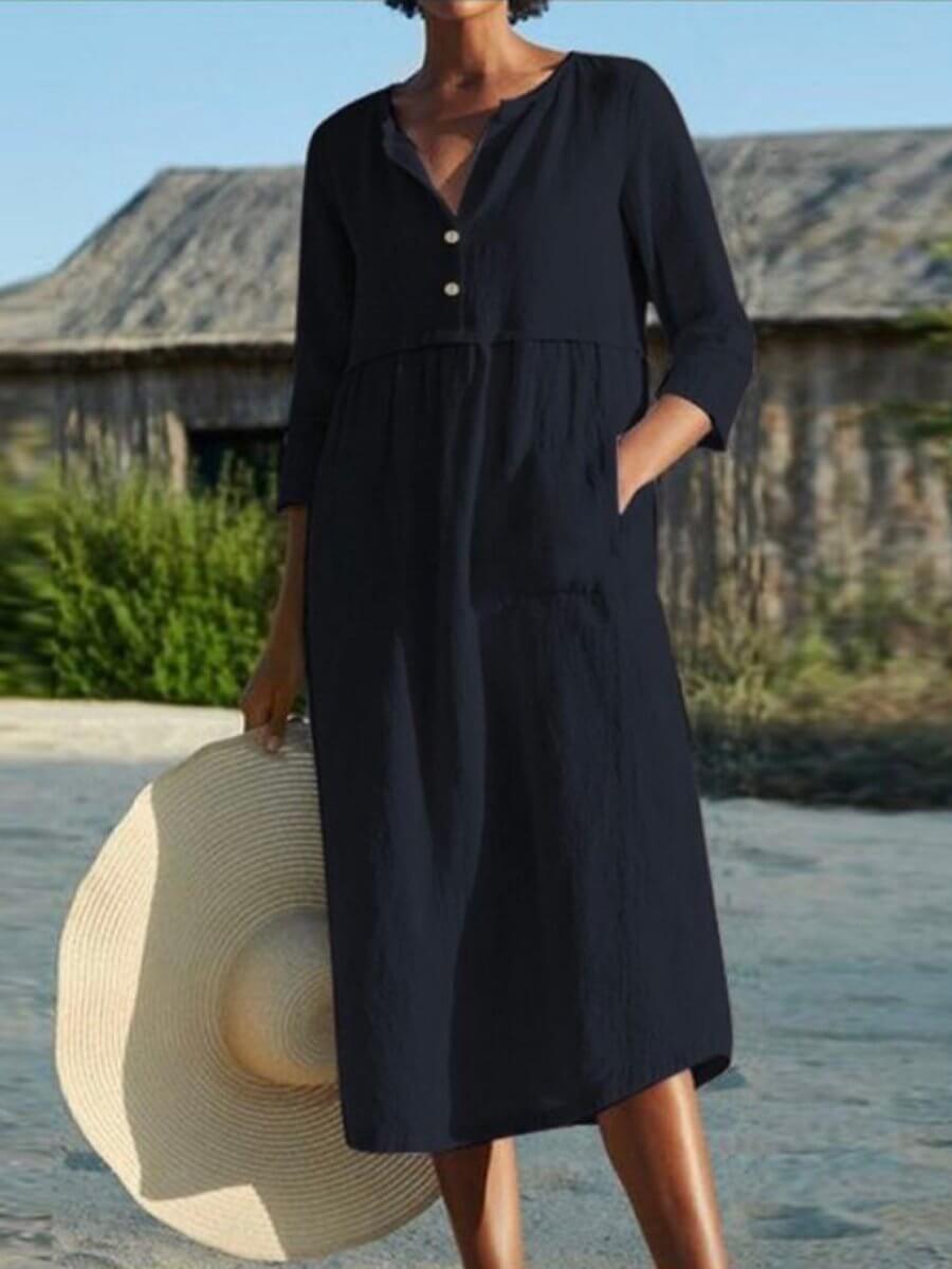Relaxed fit women's V-neck dress with half sleeves, a versatile midi for casual ladies fashion.