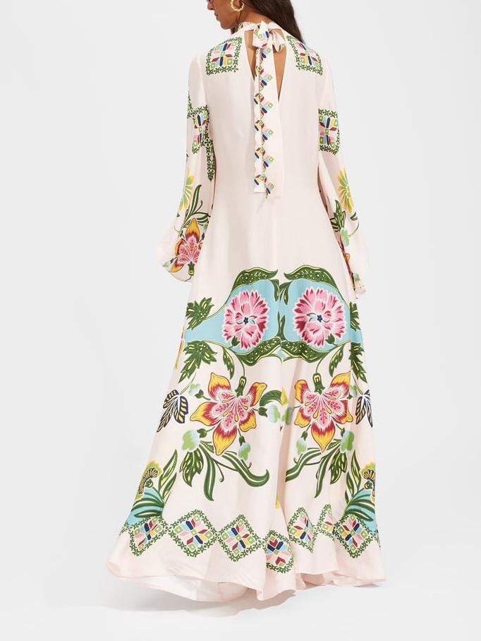 Flowy long sleeve floral maxi dress for women, an elegant cream gown ideal for summer events & special occasions.