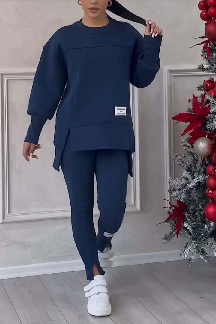 Soft women's oversized loungewear set featuring a crew neck top & full-length leggings, ideal for everyday comfort.