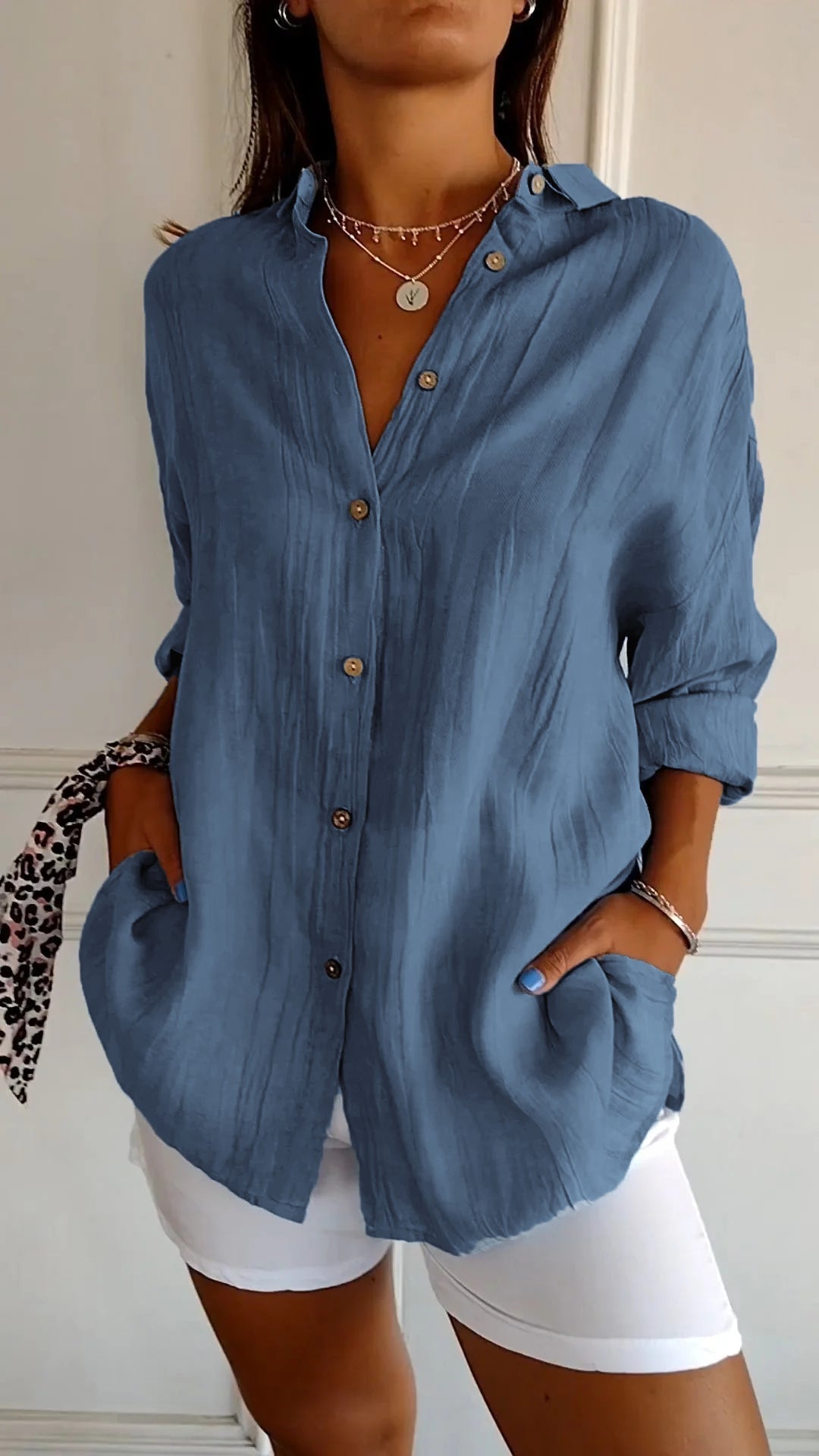 Sophisticated women's long sleeve shirt, showcasing a beautiful ruffled collar design.