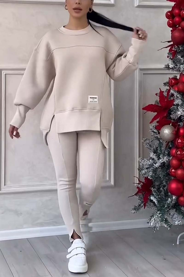 Women's oversized loungewear set with cozy crew neck sweater & matching leggings, perfect for casual comfort.