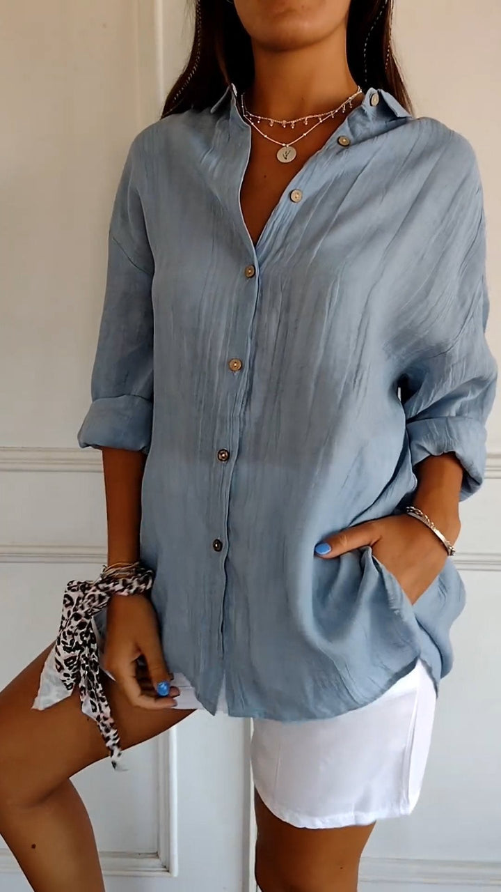 Elegant women's long sleeve blouse with ruffled collar, perfect for chic office attire.