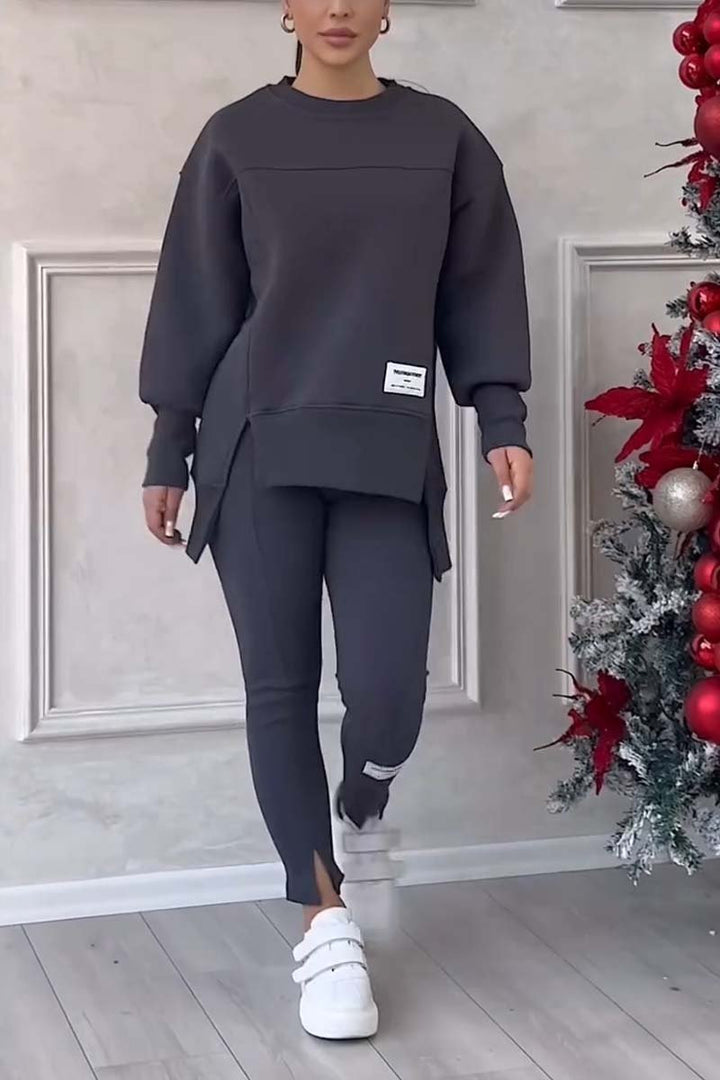 Comfortable women's leggings with elastic waist, paired with an oversized sweater for a cozy loungewear set.