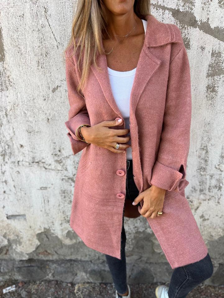 Chic women's buttoned blazer jacket, an elegant long sleeve outerwear piece for fashion.
