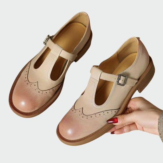 Brown women's retro Mary Jane flats, comfortable vintage footwear for everyday classic style. Elegant design.
