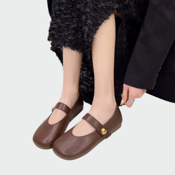 Women's classic Mary Jane footwear with comfortable block heel, round toe, and adjustable strap for all-day wear.