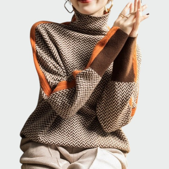 Casual women's long sleeve herringbone turtleneck sweater, providing stylish warmth and comfort.