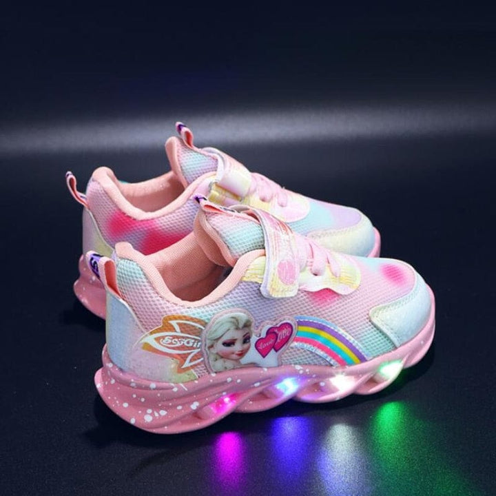 Child wearing GlowStride LED light-up sneakers, running and playing outdoors.