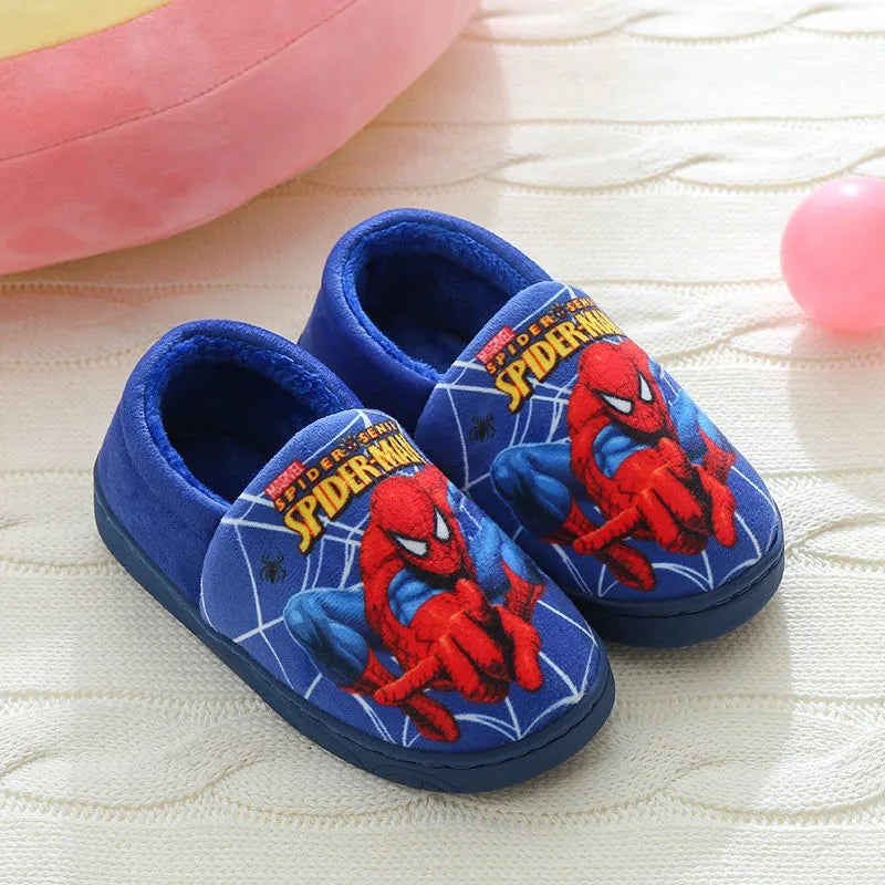 Close-up: Kids Spider-Man cozy slippers, vibrant red & blue superhero design. Soft cotton warm indoor footwear.