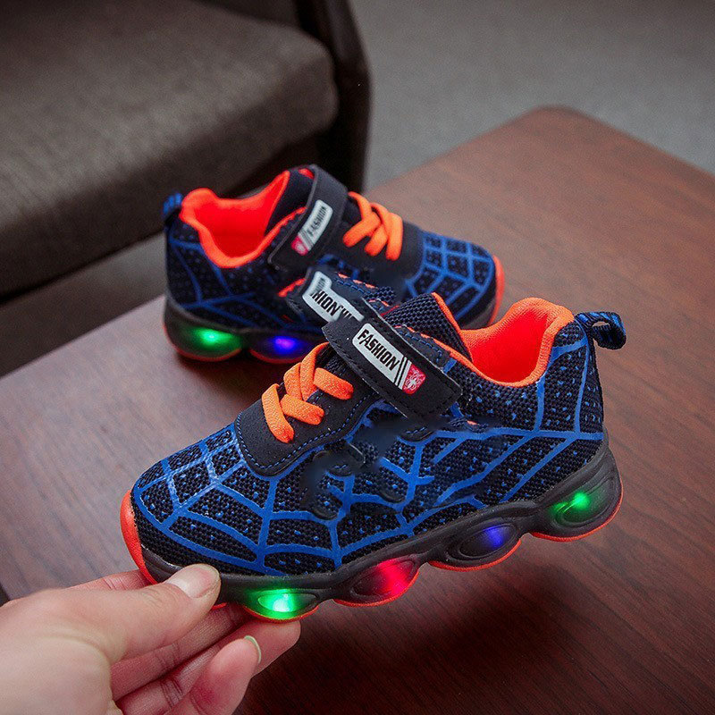Fun superhero LED sneakers for kids, perfect for active boys & girls. Bright glowing athletic footwear.