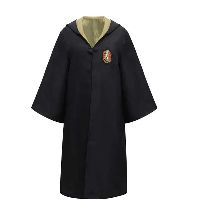 Excited kid in full Hogwarts wizard costume, posing with wand for magical role-play fun.
