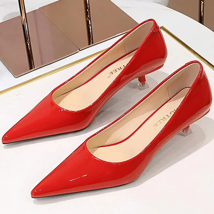 Modern black kitten heels for women, chic and elegant footwear with a low heel.