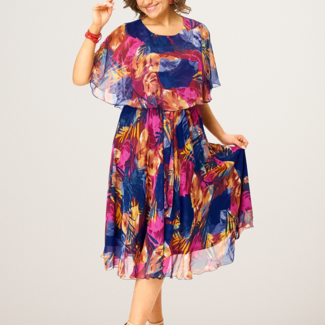 Plus size women's summer midi dress, vibrant print A-line, comfortable flowing design for elegant vacation wear.