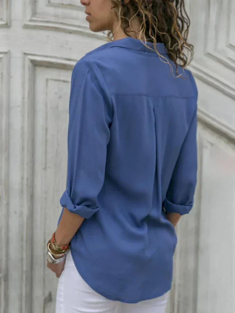 Women's classic white blouse. Elegant, versatile top for workwear & casual fashion.
