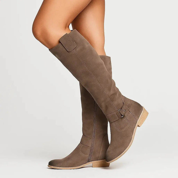 Stylish beige suede knee-high boots for women, featuring a comfortable block heel & side zipper. Ideal everyday footwear.