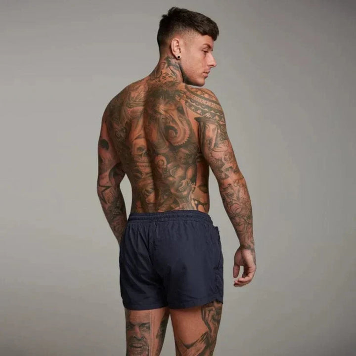 Men's beach swim shorts, perfect for summer pool days & vacations. Stylish, quick-dry active swimwear.