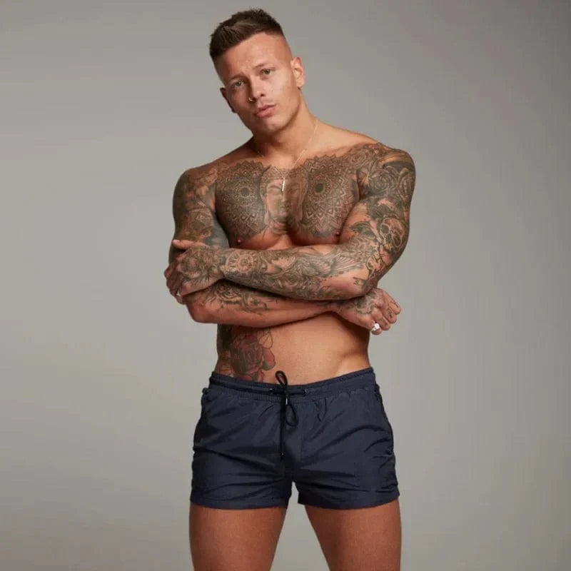 Men's quick-dry swim shorts with pocket for stylish summer beach & pool wear. Perfect vacation swimwear.