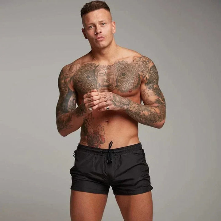 Stylish short men's swim trunks, ideal for summer beach fun. Quick-dry swimwear with a convenient pocket.