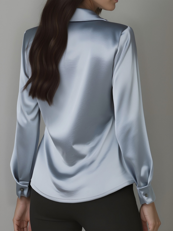 Elegant satin blouse for women, with a beautiful draped neckline. A refined fashion top.