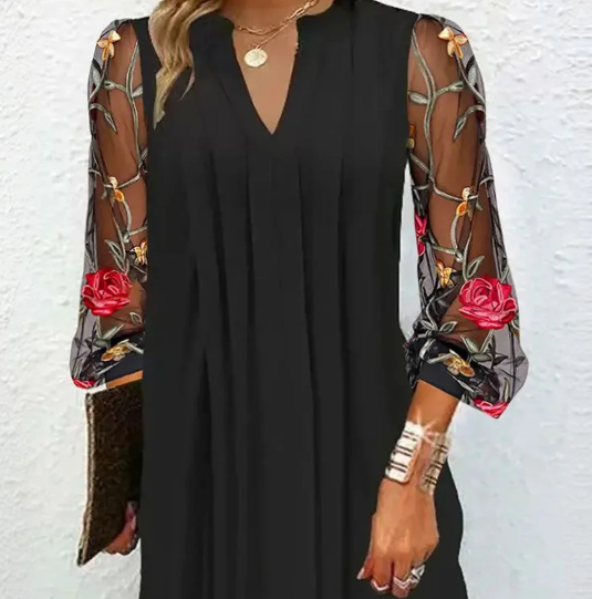 Sophisticated women's formal black dress with elegant floral sleeves, ideal for special occasions & timeless style.