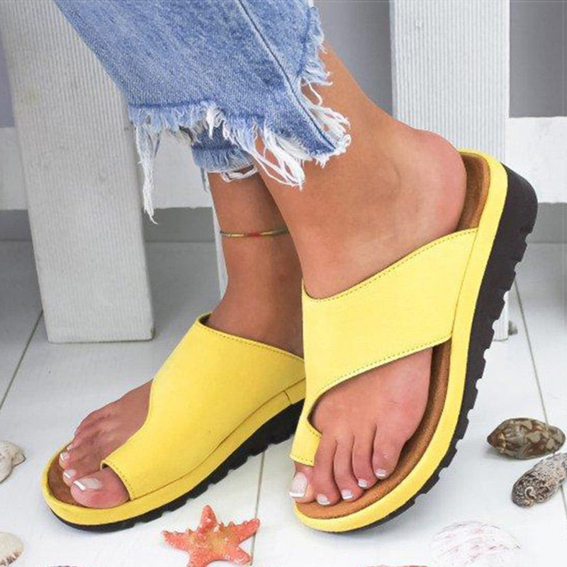 Ergonomic ladies' comfort sandals with supportive sole, providing foot relief & easy slip-on wear.