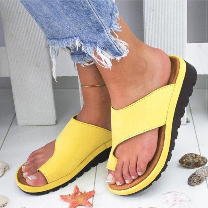 Ergonomic ladies' comfort sandals with supportive sole, providing foot relief & easy slip-on wear.