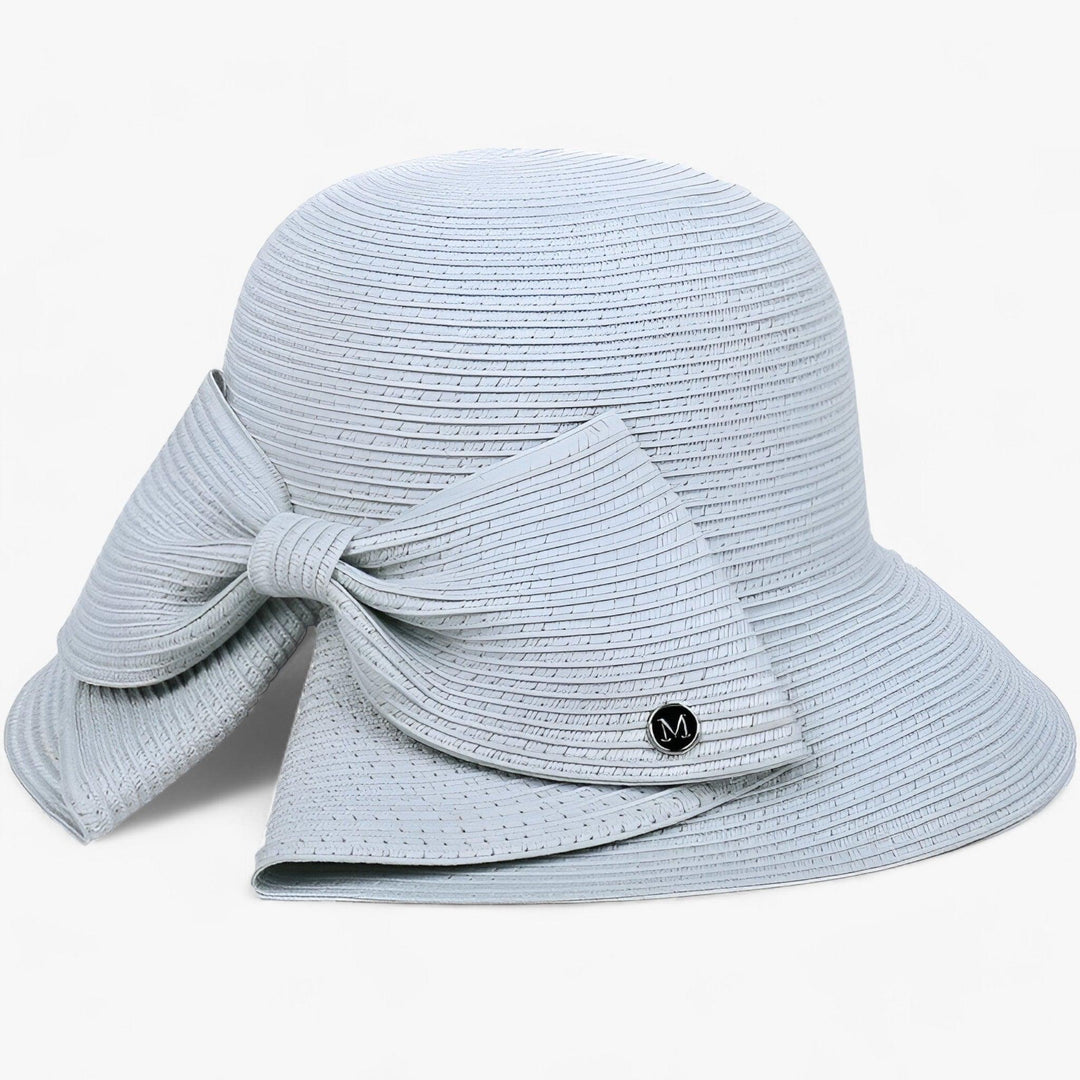 Women's straw sun hat with a unique asymmetrical bow, a must-have elegant summer accessory.