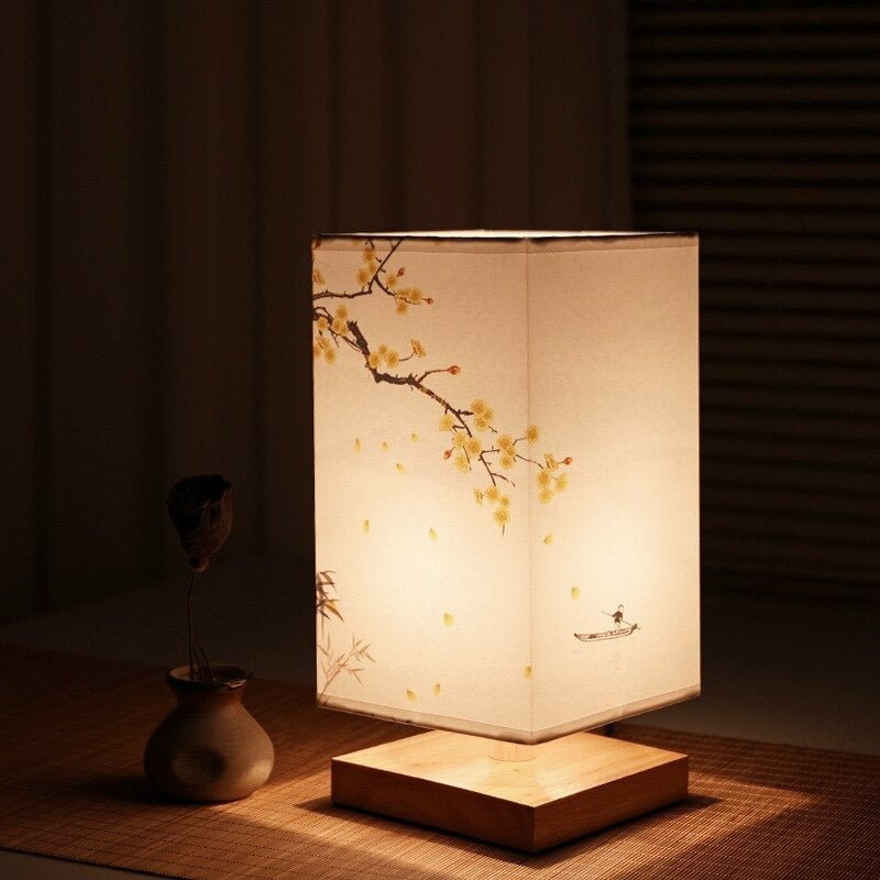Gentle mood light from a Japanese print Scandinavian table lamp, perfect for relaxation and style.