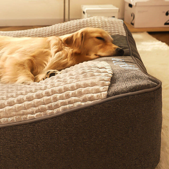 Grey orthopedic memory foam dog bed with headrest, luxury comfort for large dogs.