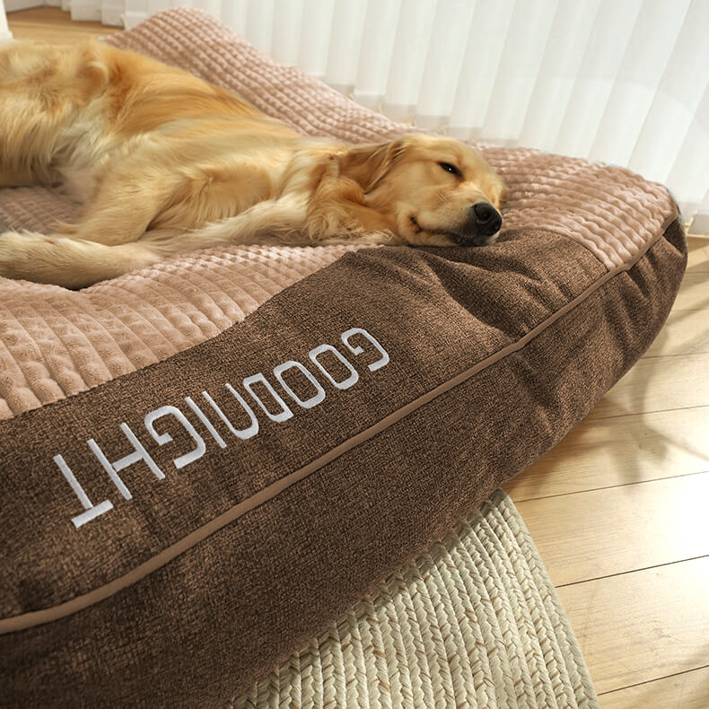 Joint support luxury dog bed, large orthopedic memory foam cushion with headrest for pet comfort.