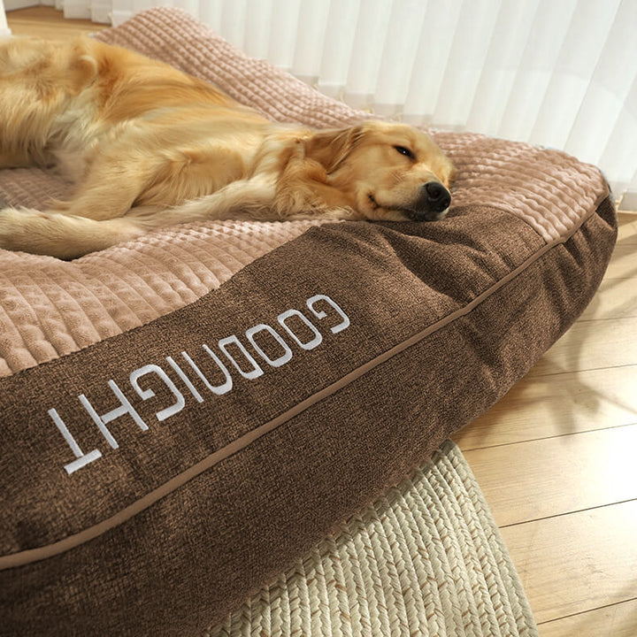 Joint support luxury dog bed, large orthopedic memory foam cushion with headrest for pet comfort.