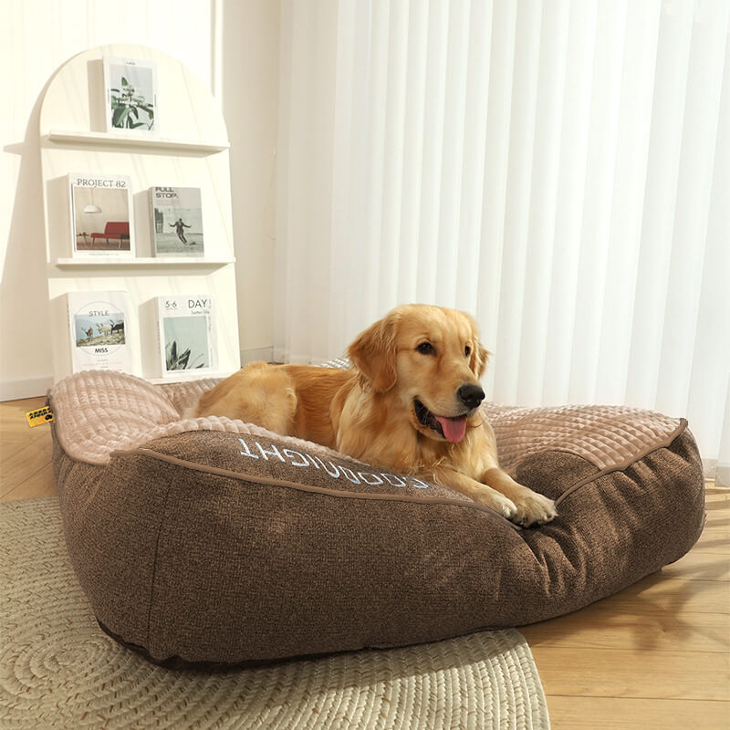 Orthopedic large dog bed with memory foam & headrest, ideal for joint support & comfort.