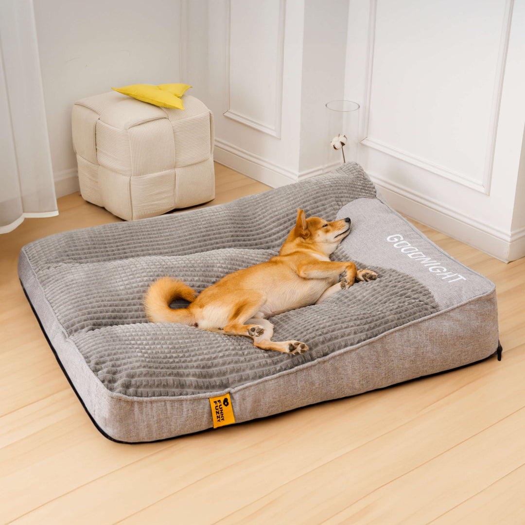 Large grey orthopedic memory foam dog bed with headrest, comfortable & washable cover.
